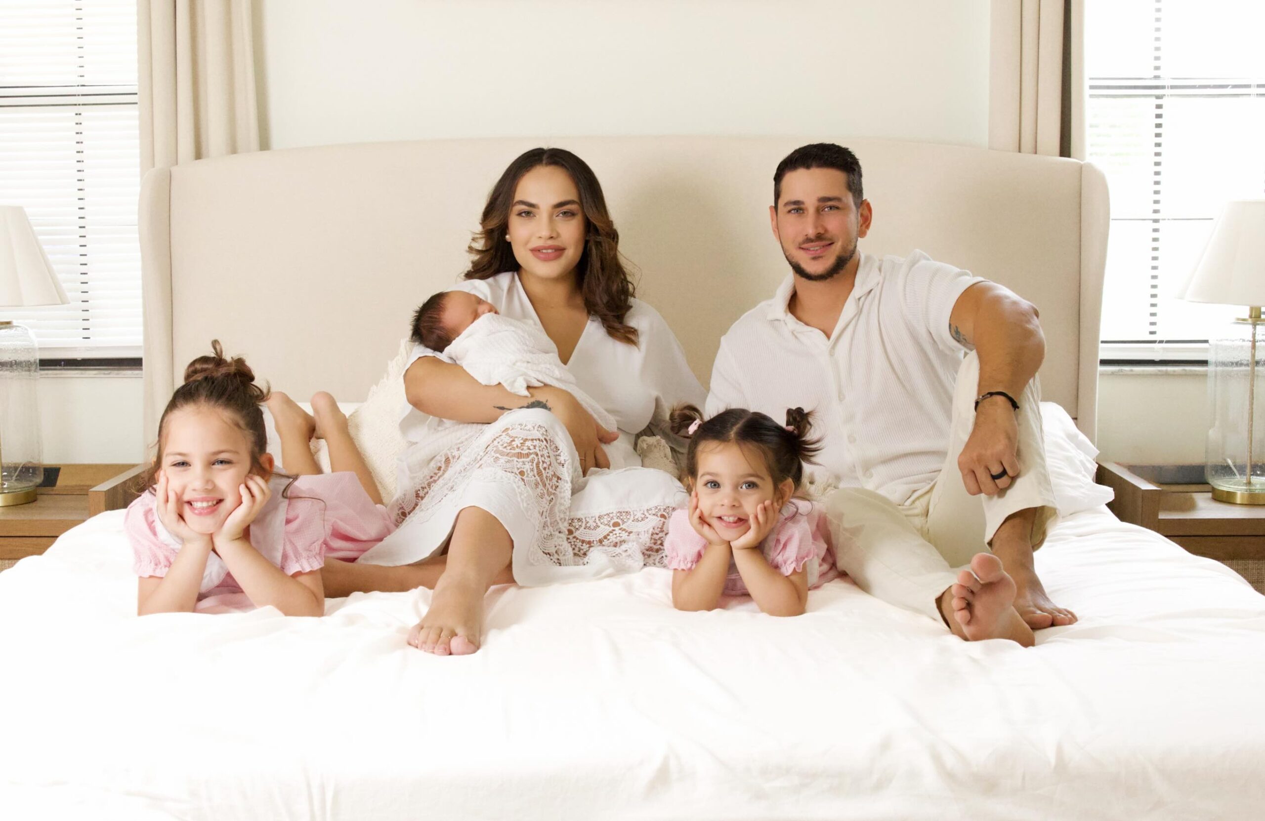Family portrait with parents, children and newborn photographed by Sarlen Studios in Orlando