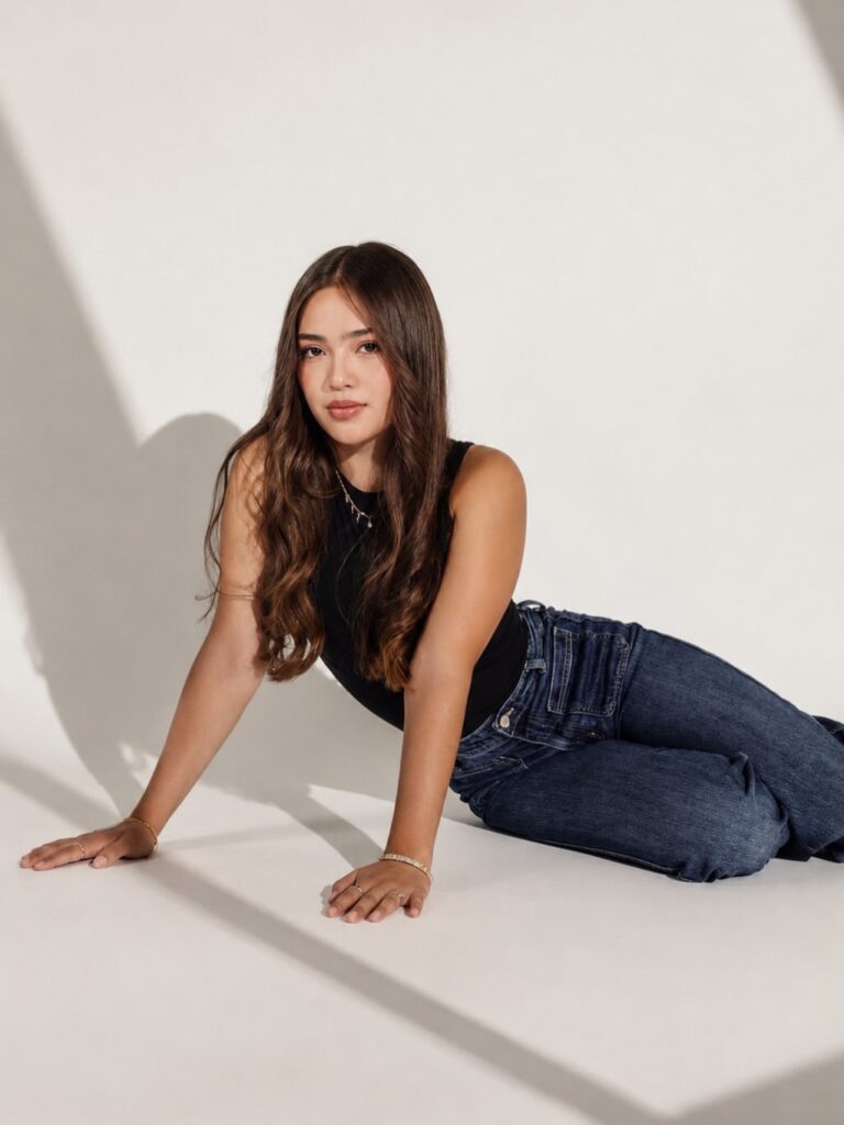 Studio portrait of a young woman in natural light